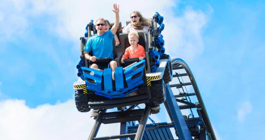 A family riding a roller coaster at Cedar Point